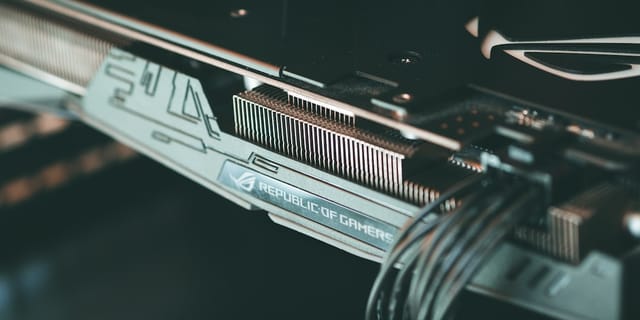 Close-up macro photograph of a GPU circuit board showing copper traces and chip components