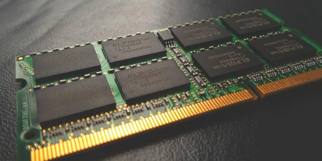 Close-up of server DDR5 RDIMM memory modules in a dual-socket motherboard.
