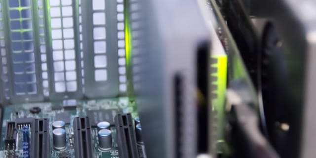 Close-up of a server motherboard showing CPU sockets and memory slots