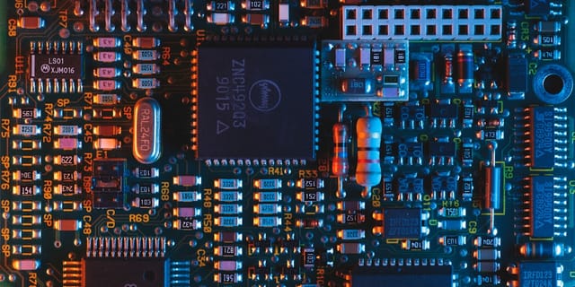 Close-up of GDDR memory chips soldered onto a graphics card PCB