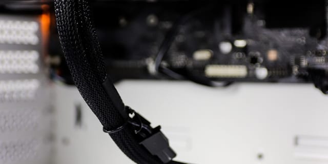 Close-up of computer hardware showing a GPU and motherboard components
