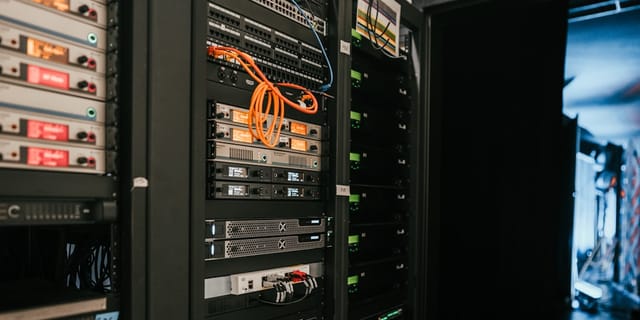 Close-up of server GPUs with blue LED indicators