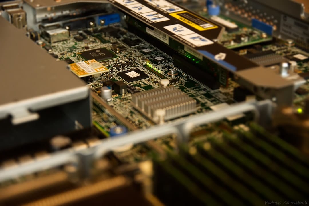 Close-up of a high-end desktop motherboard showing CPU socket and large DDR5 RAM slots.