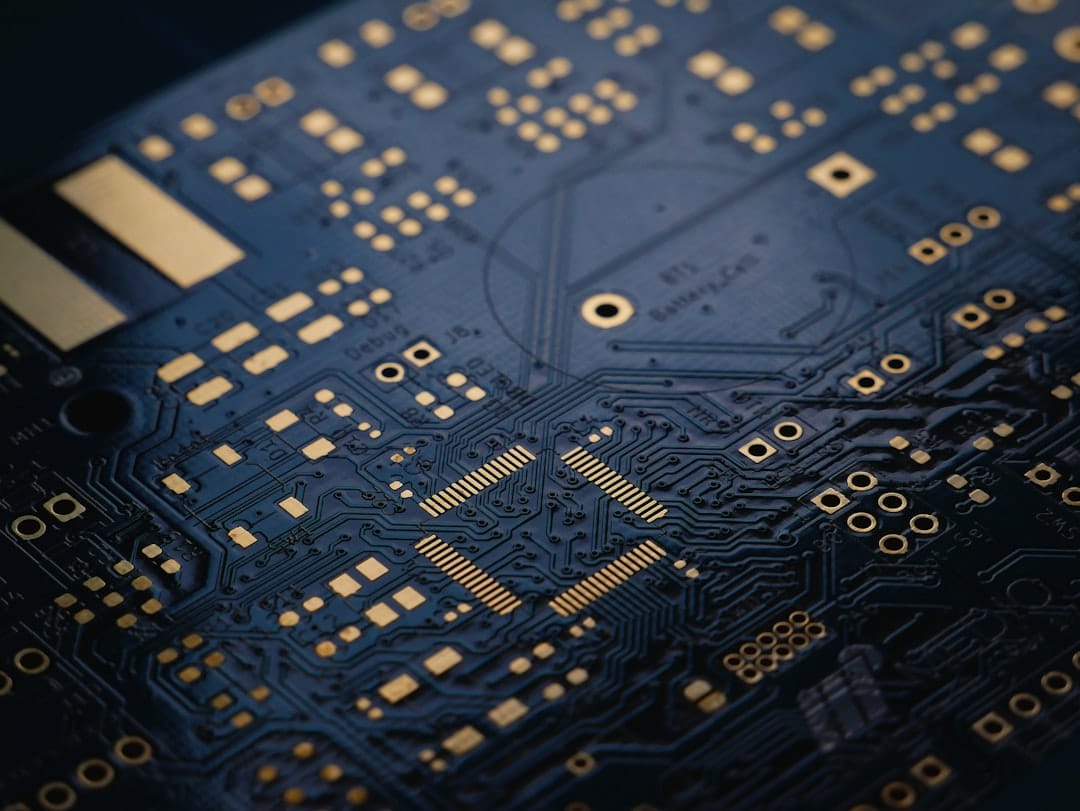 Close-up of a green circuit board with copper traces, representing low-level hardware optimization.