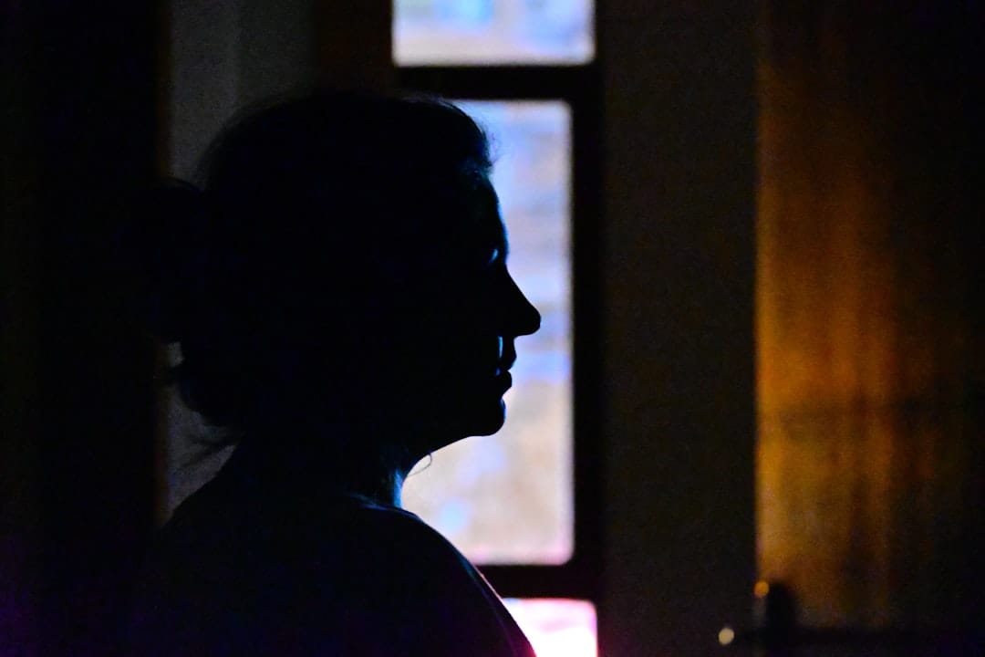 A person's silhouette standing in the dark — Ox Alpha's developer has chosen to remain anonymous
