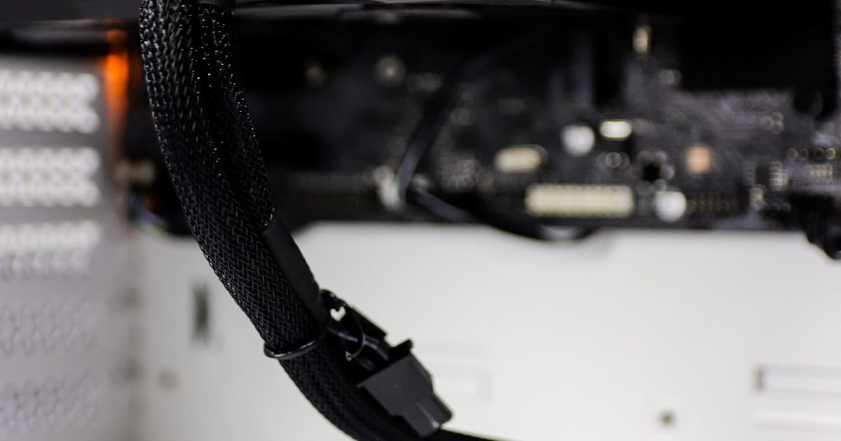 Close-up of computer hardware showing a GPU and motherboard components