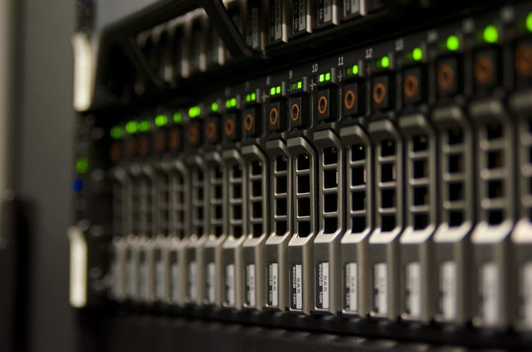 Rows of server racks in a dimly lit data center aisle