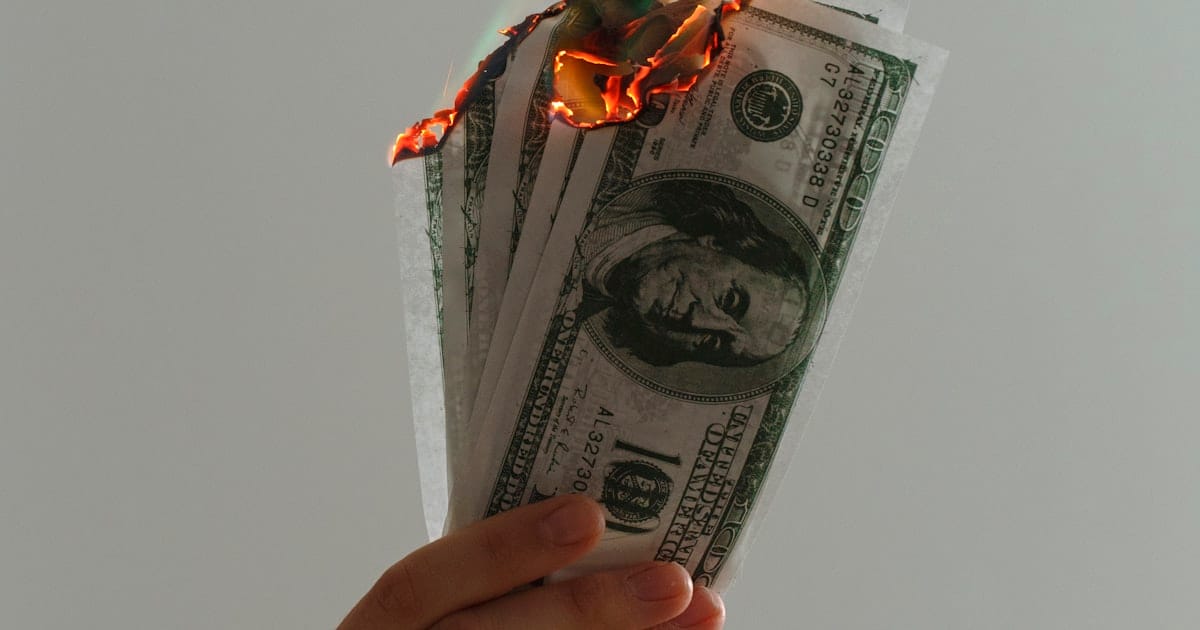 Time-lapse photograph of US dollar banknotes on fire